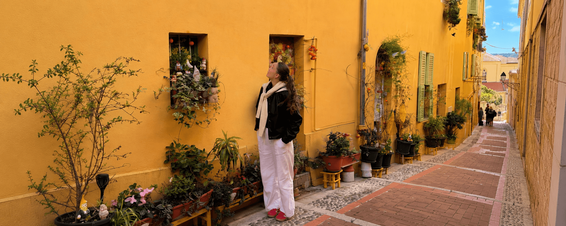 Woman planning a trip with a map and passport on a table